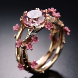 Anillo de oro con cristal rosa y florecitas