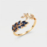 Aurelie – Anillo de oro rojo con piedra azul.